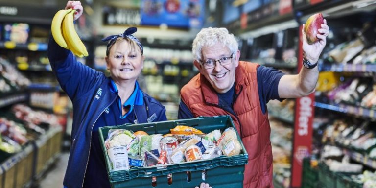 people posing with food basket