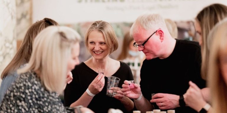 people drinking and laughing