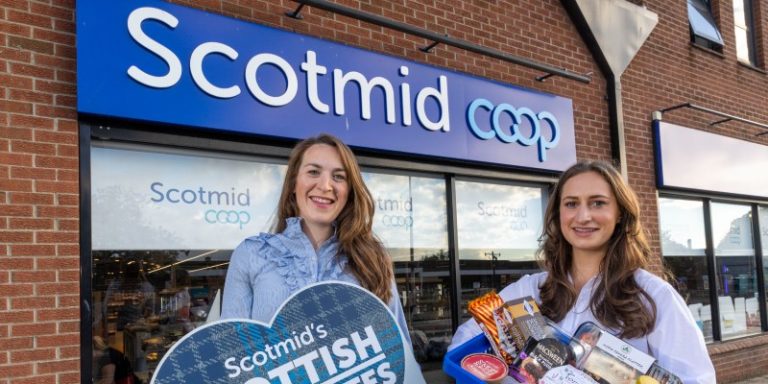 two women holding food products