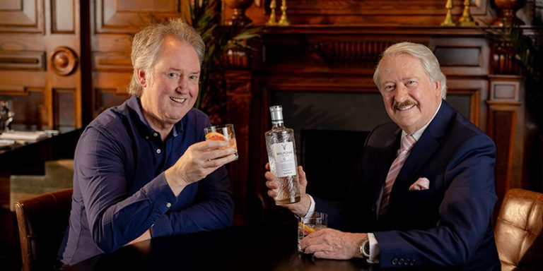Two men with a bottle of Wolfcraig Gin
