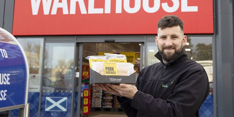 Man holding sausage